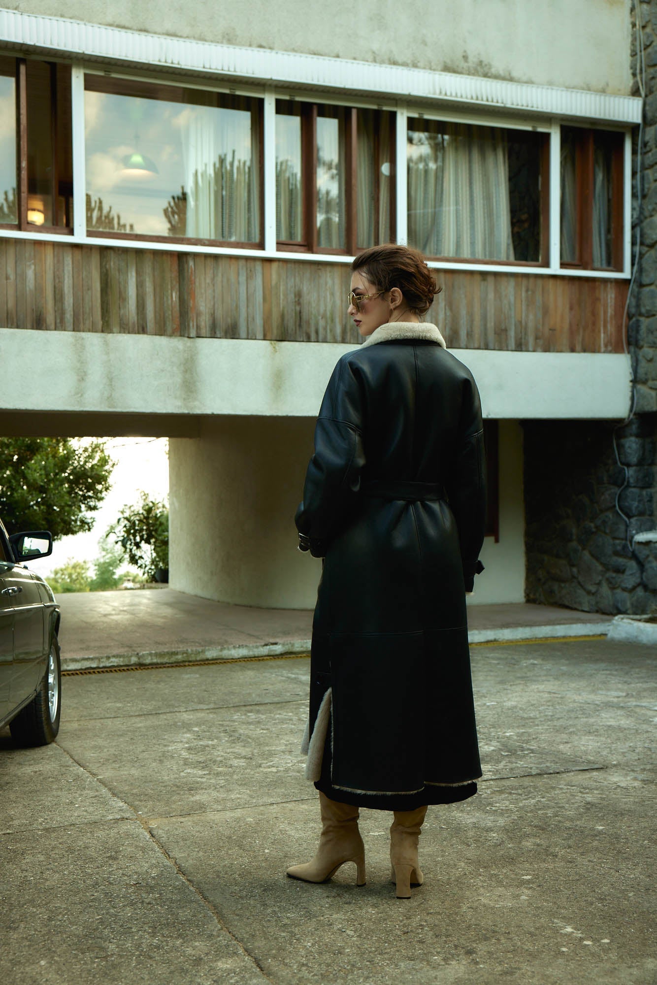 Model wearing Berghof Shearling Coat back view