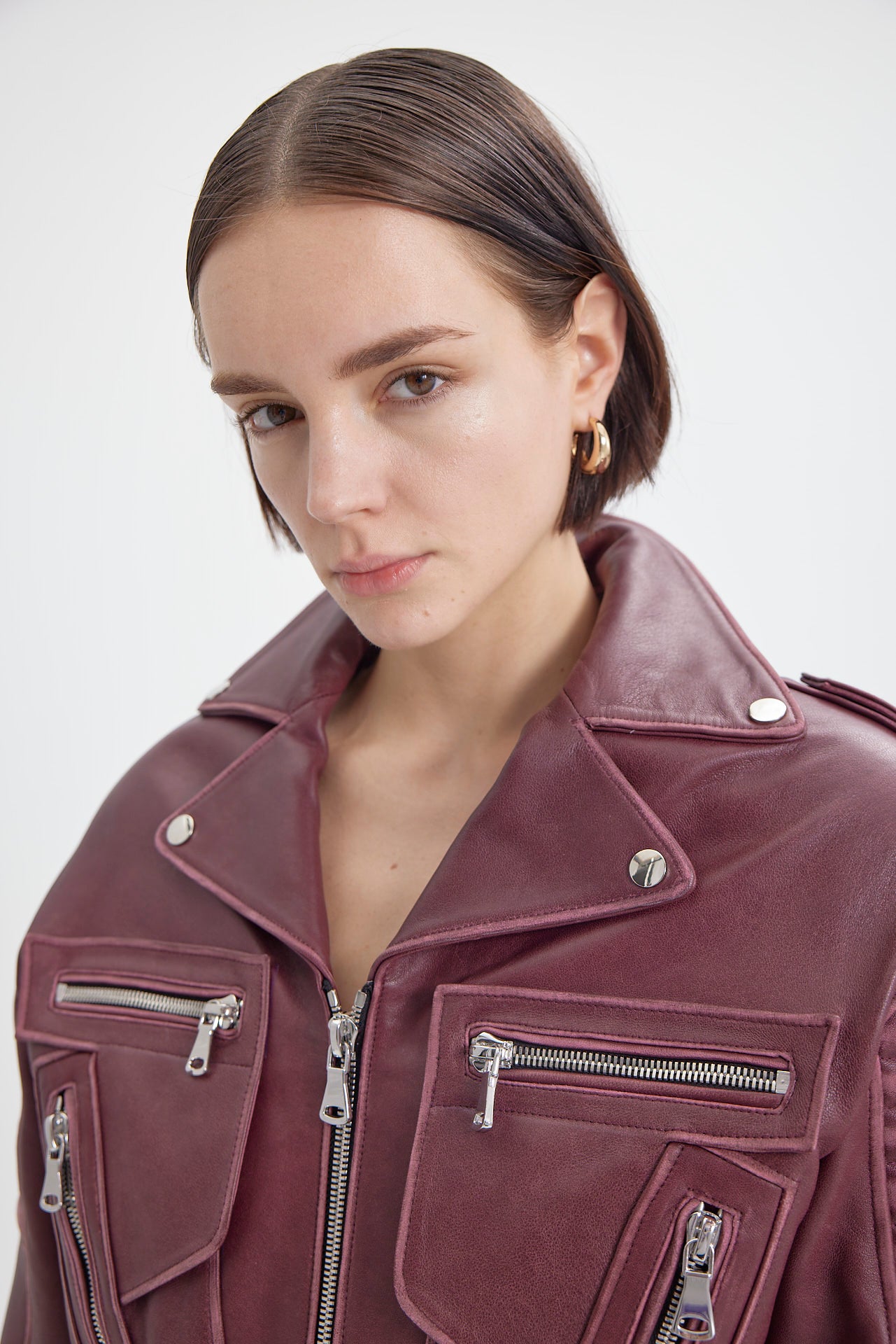 Model wearing Burgundy Moto Jacket close-up